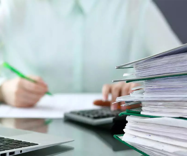 Bookkeeping services with files, paperwork, calculator and records