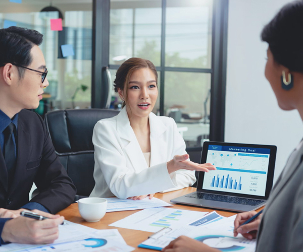 Top payroll services team discussing financial reports and business goals