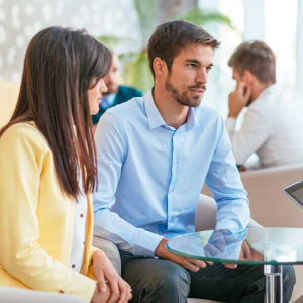 Two individuals engaged in a discussion about SMSF tax return services