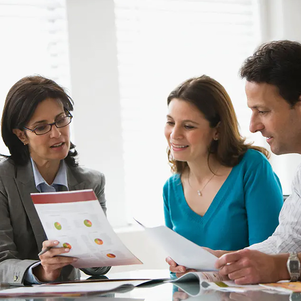 A couple meets with a consultant for SMSF accounting services and advice